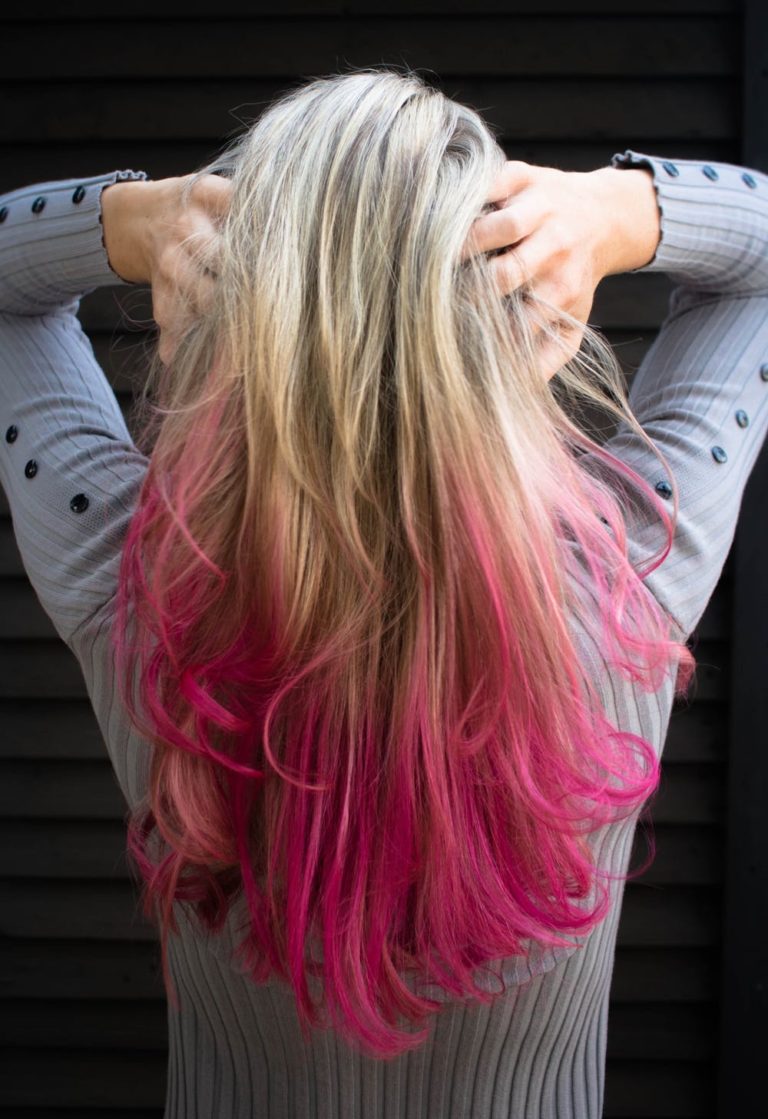 Girl with coloured hair pink hair care