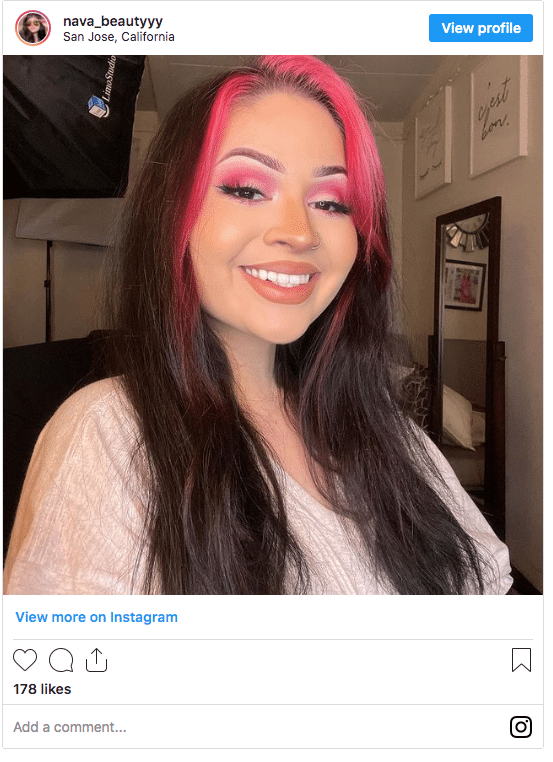 bright pink fringe on brunette hair Instagram post