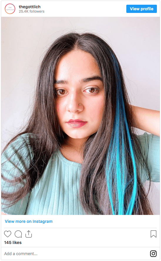 blue clip in on black hair color instagram post