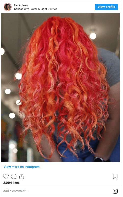 flame red curly hair salon instagram post
