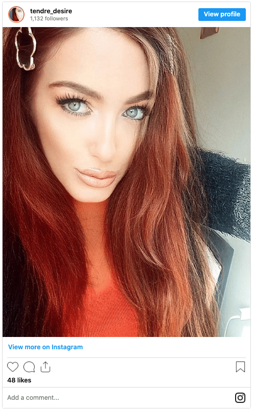 blue eyes with red hair and blonde highlights instagram post