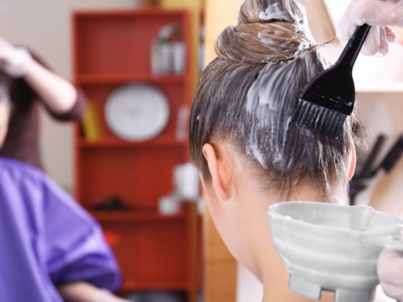 hair due being applied from bowl to hair with tint brush