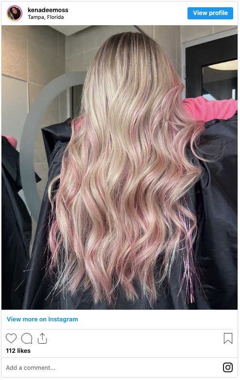 Pastel pink highlights in blonde hair