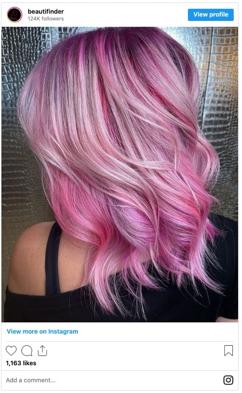neon pink and pastel pink highlights on blonde hair